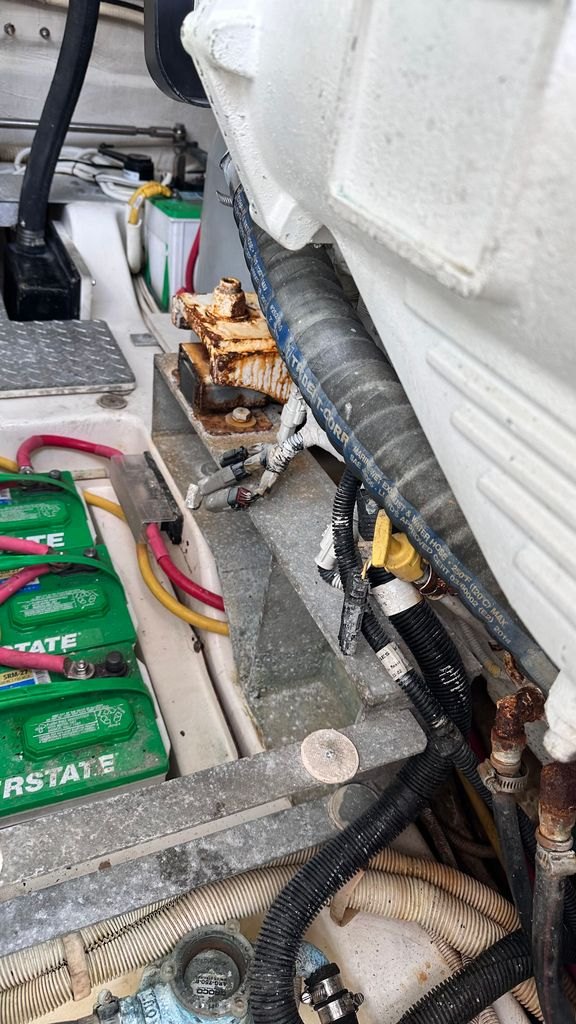 A battery bank and wiring runs in an engine space, one of the first places to look on a used boat