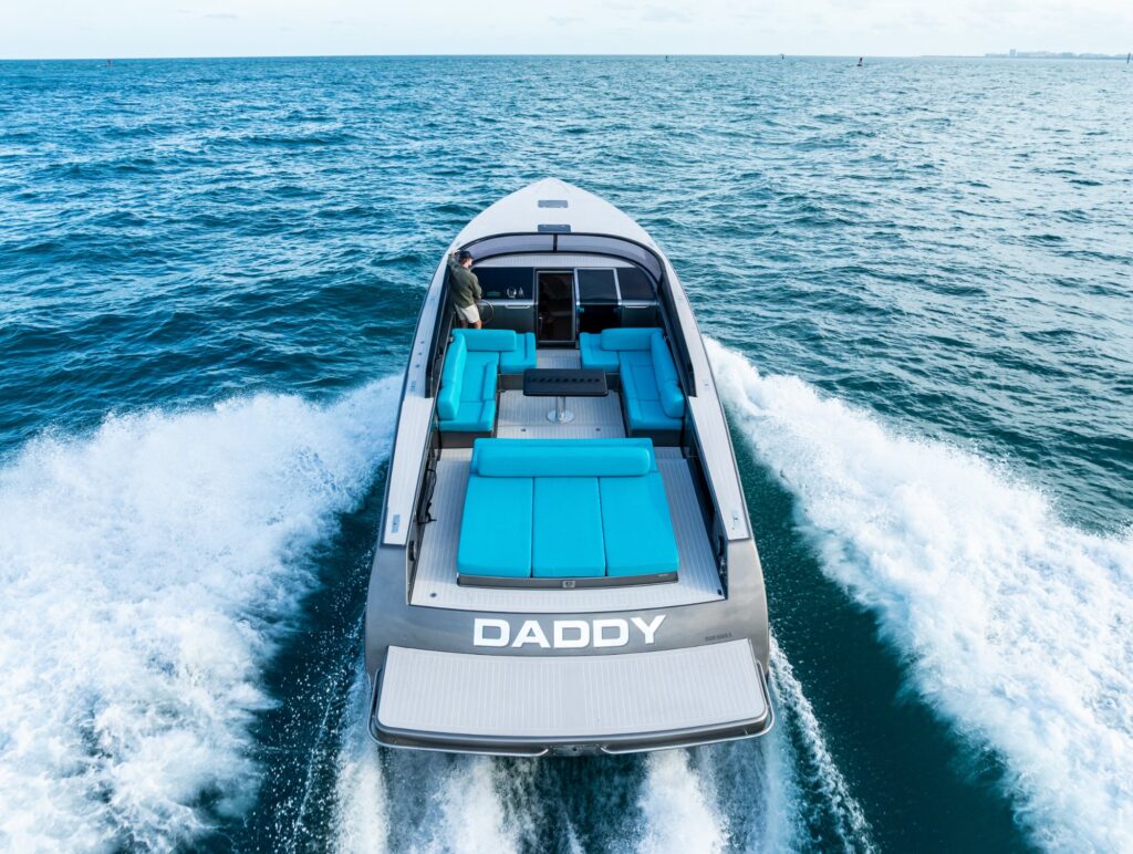 A VanDutch 55 dayboat running offshore in South Florida, seen from the stern quarter